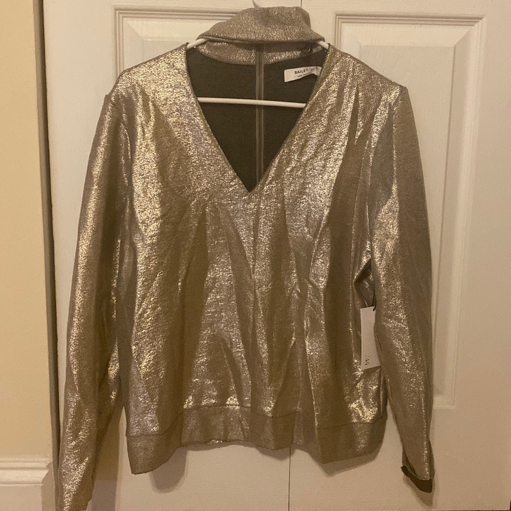 Sparkly gold V neck long sleeve, choker styled around the neck